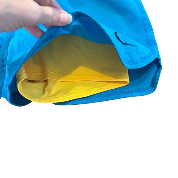 Nike Women’s NEW bright blue athletic shorts w yellow bikers, Size Large - Picture 3 of 4